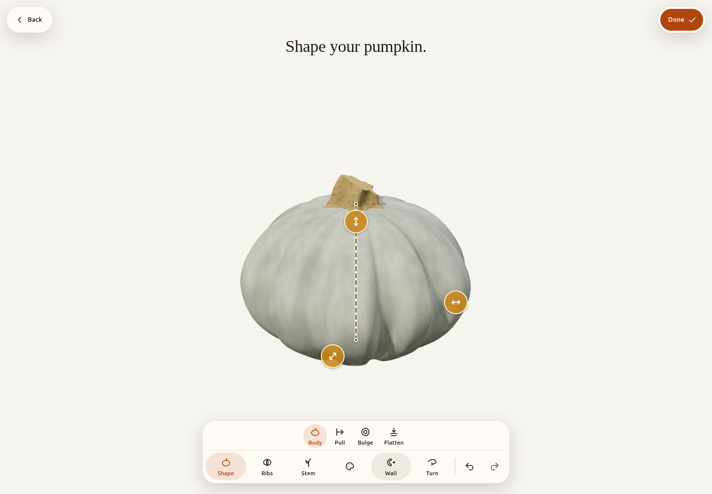 The current app’s Customize view, with a blue-grey pumpkin, on-object shape grips and the Shape, Ribs, Stem, Colour, Wall and Turn tools.